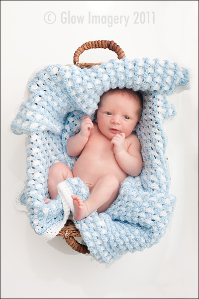 Newborn resting in Kansas City baby photographers image